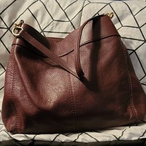 Maroon/burgundy gently used Coach handbag. More pictures can be made upon reques